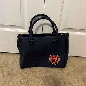 A Chicago bears purse that comes with a longer strap